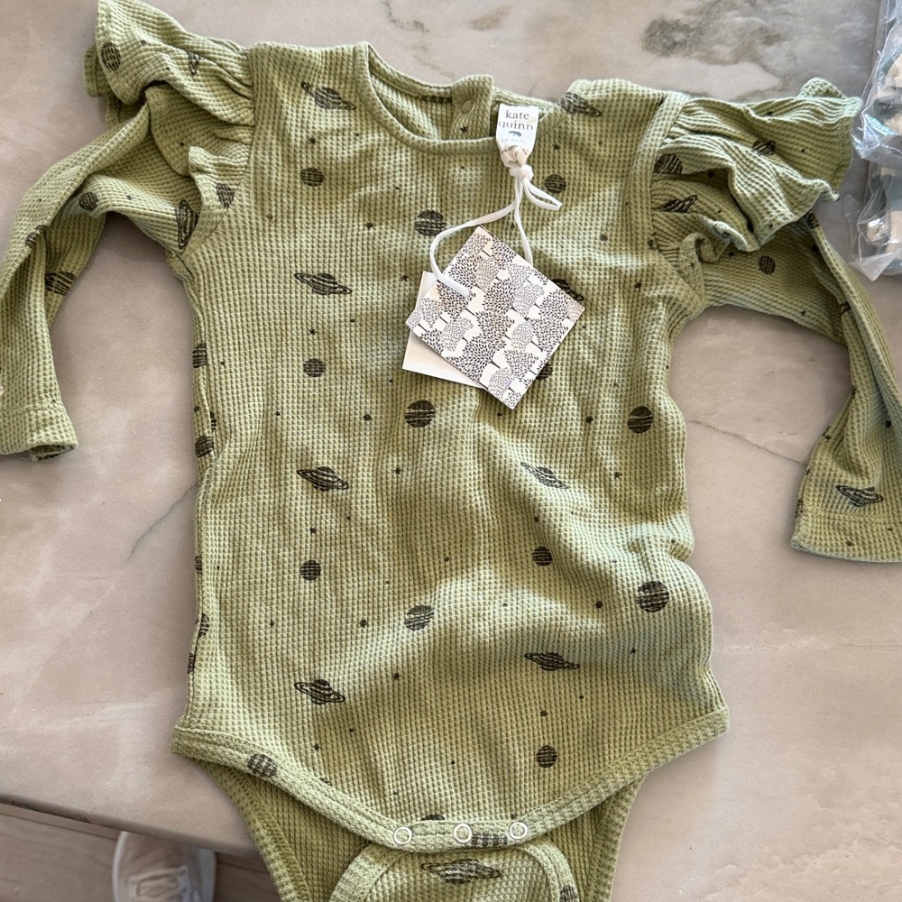 Kate Quinn long sleeve shoulder ruffle bodysuit in olive planets 12-18M